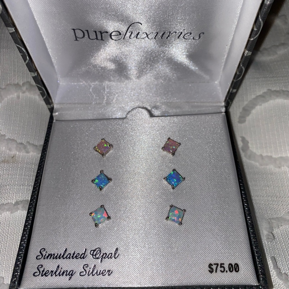 Three sets of opal earrings